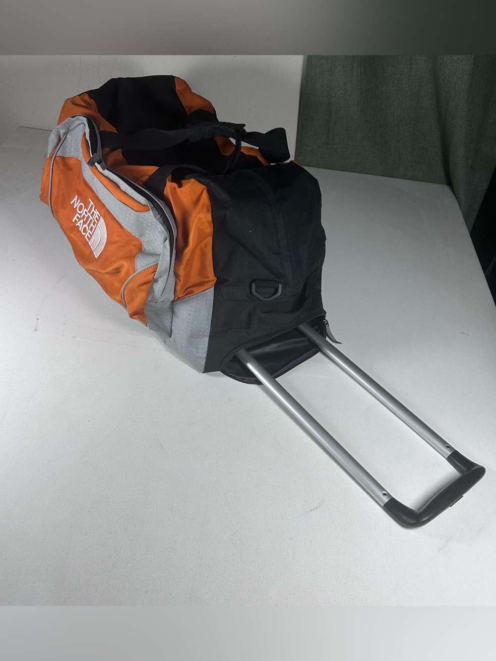 The North Face Rolling Thunder 26” Wheeled Carry On Duffle Bag Orange Silver